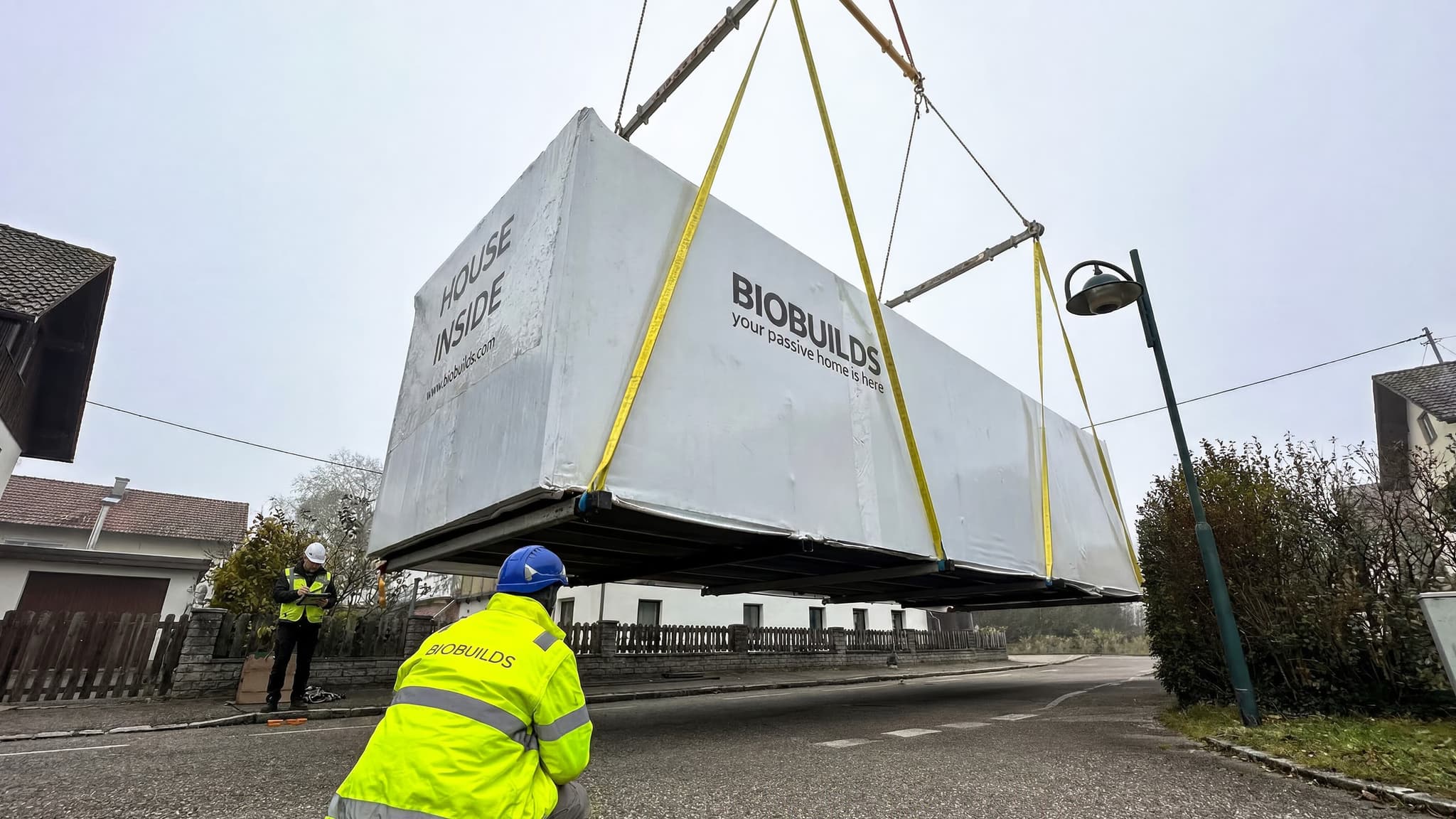 Mounting team lifting a module