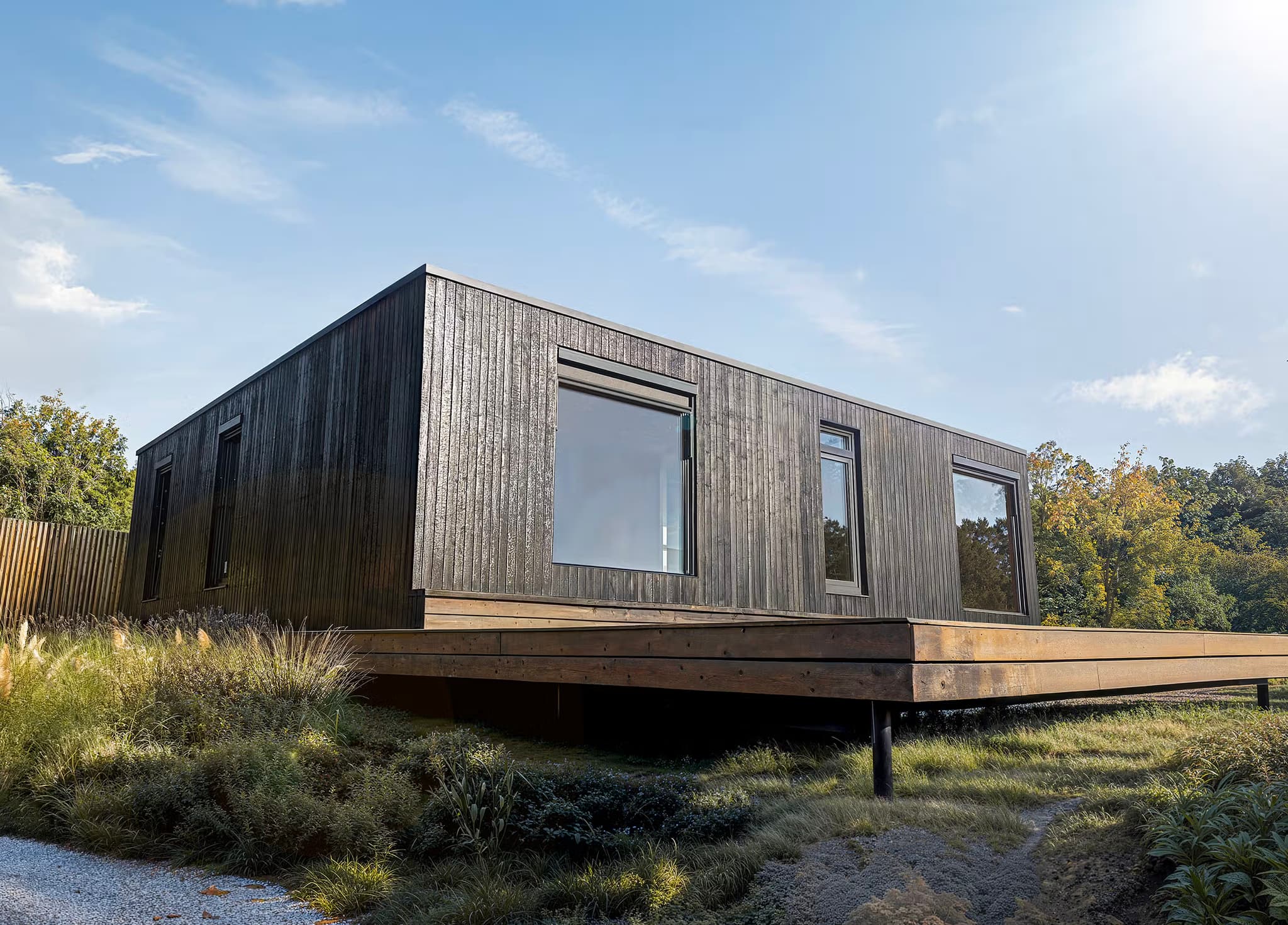 Modern modular wooden house surrounded by greenery